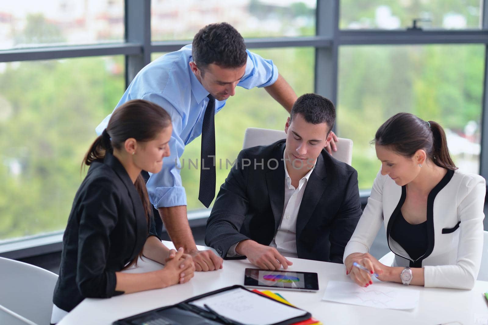 Group of happy young  business people in a meeting at office