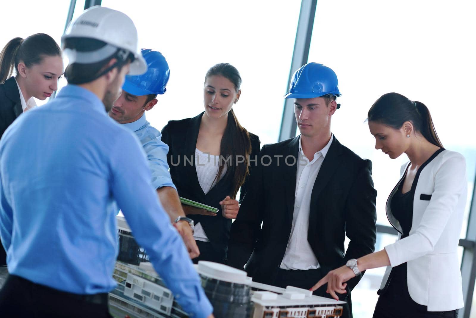 Group of happy young  business people in a meeting at office