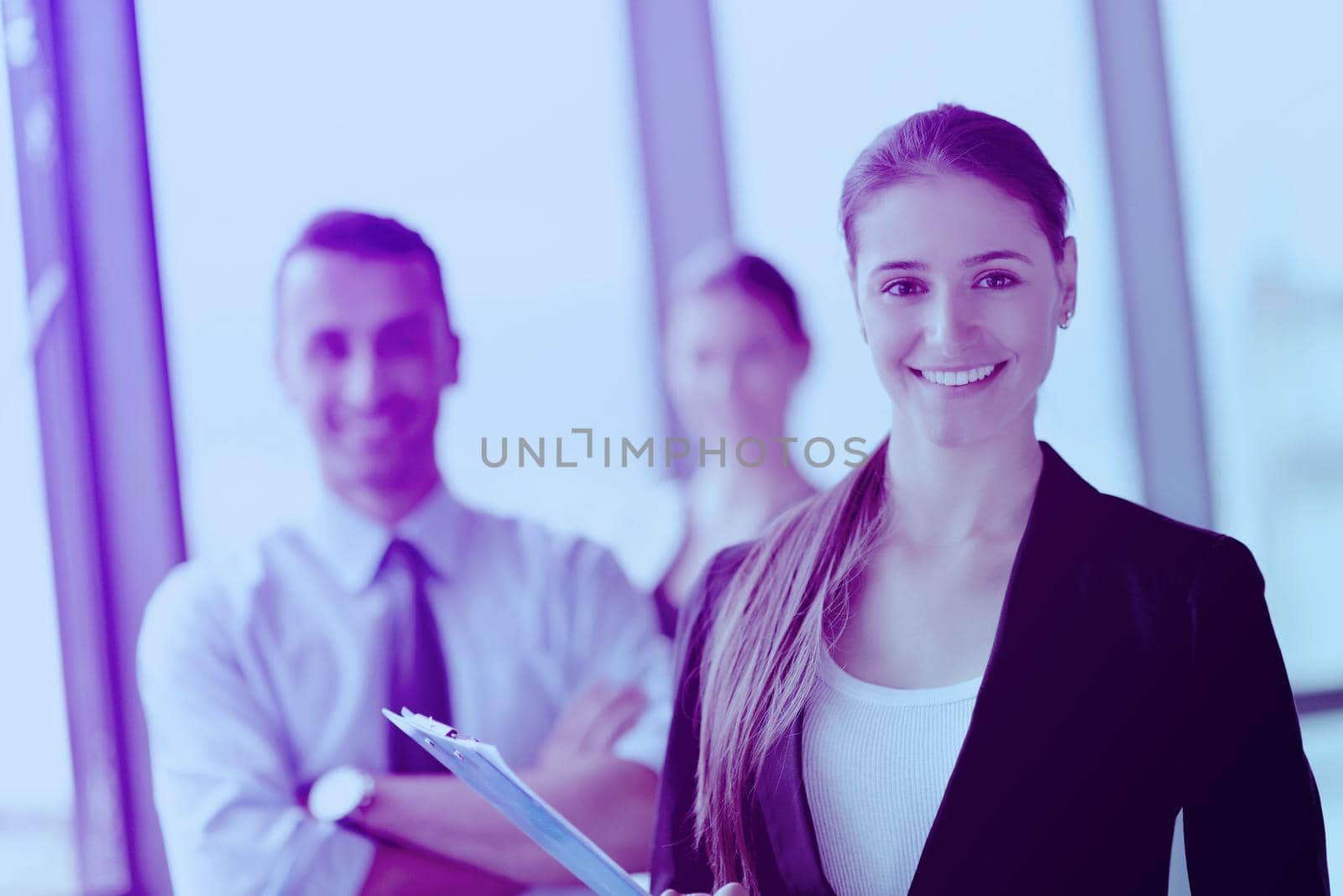 Group of happy young  business people in a meeting at office