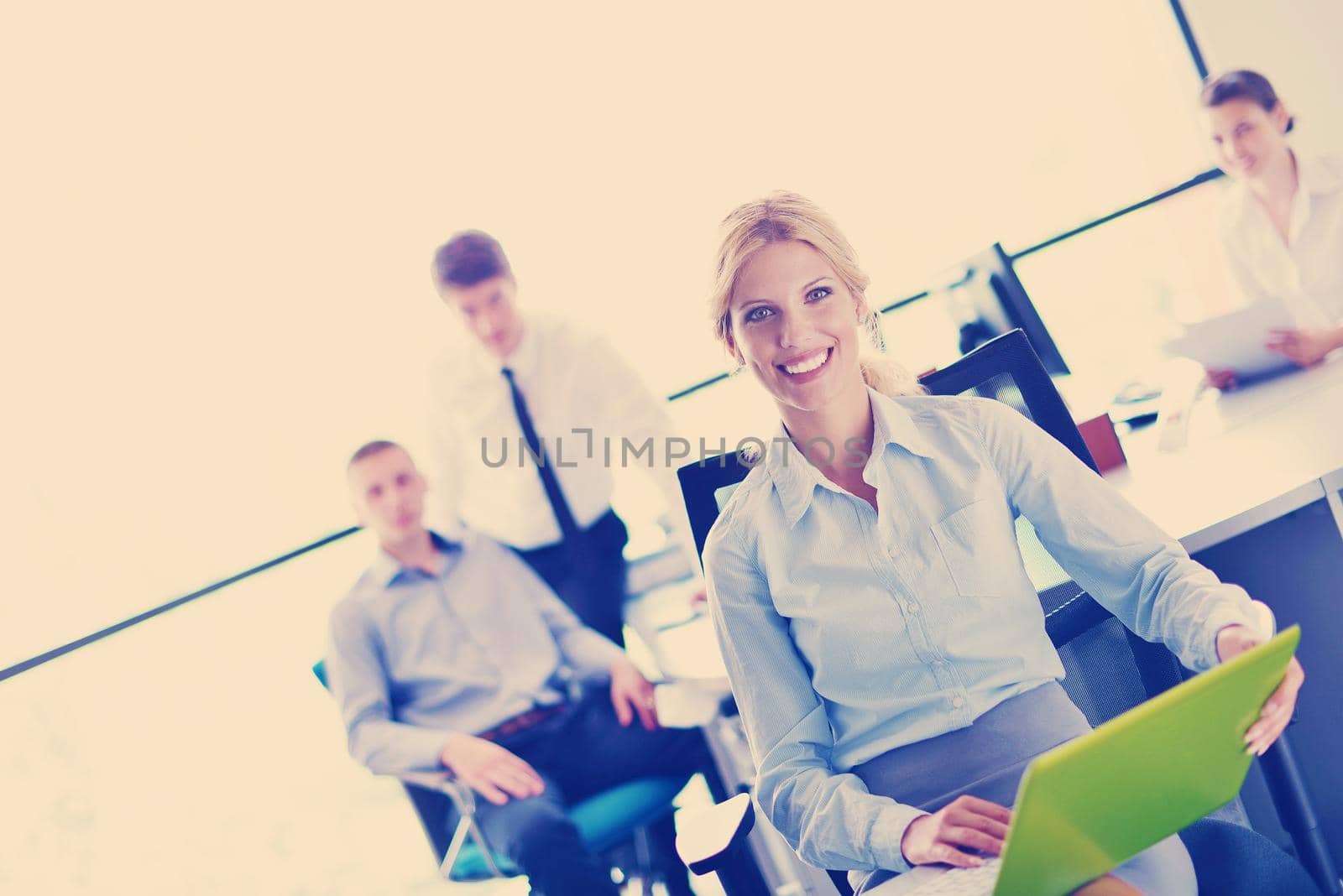 business woman  with her staff,  people group in background at modern bright office indoors