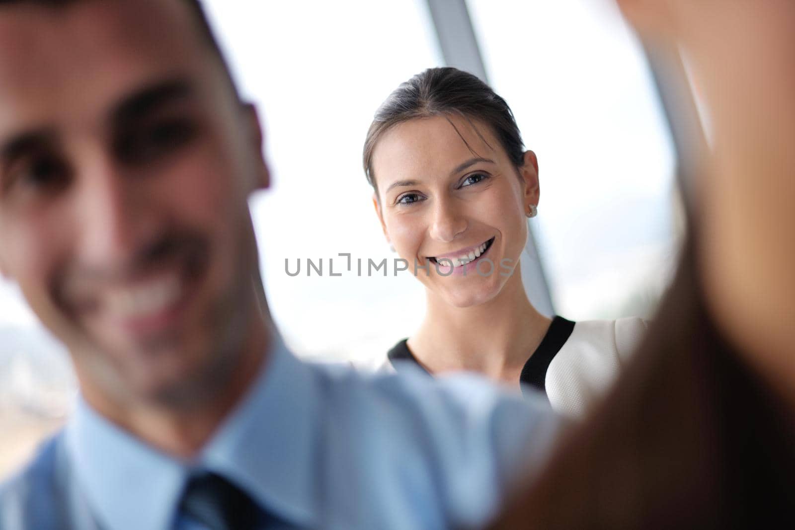 Group of happy young  business people in a meeting at office