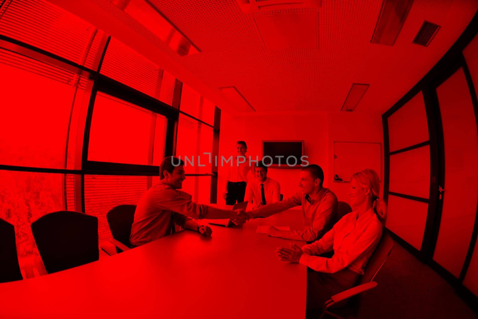 Group of happy young  business people in a meeting at office