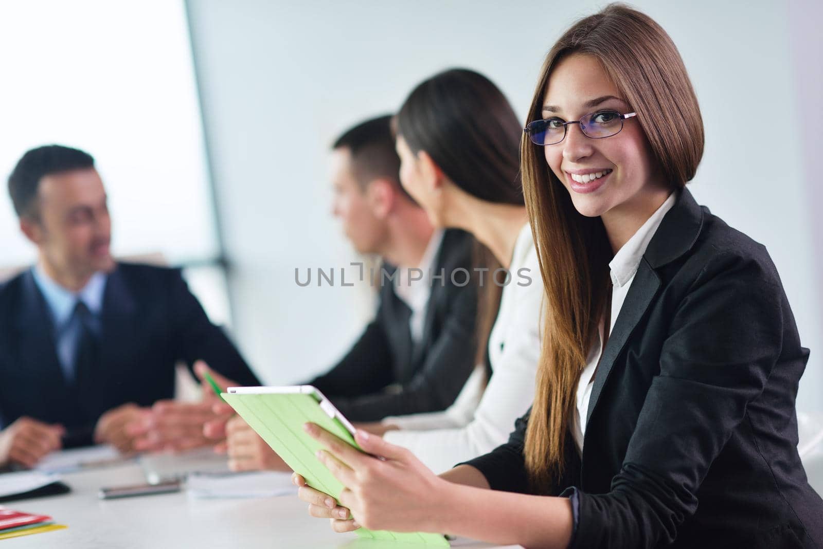 Group of happy young  business people in a meeting at office