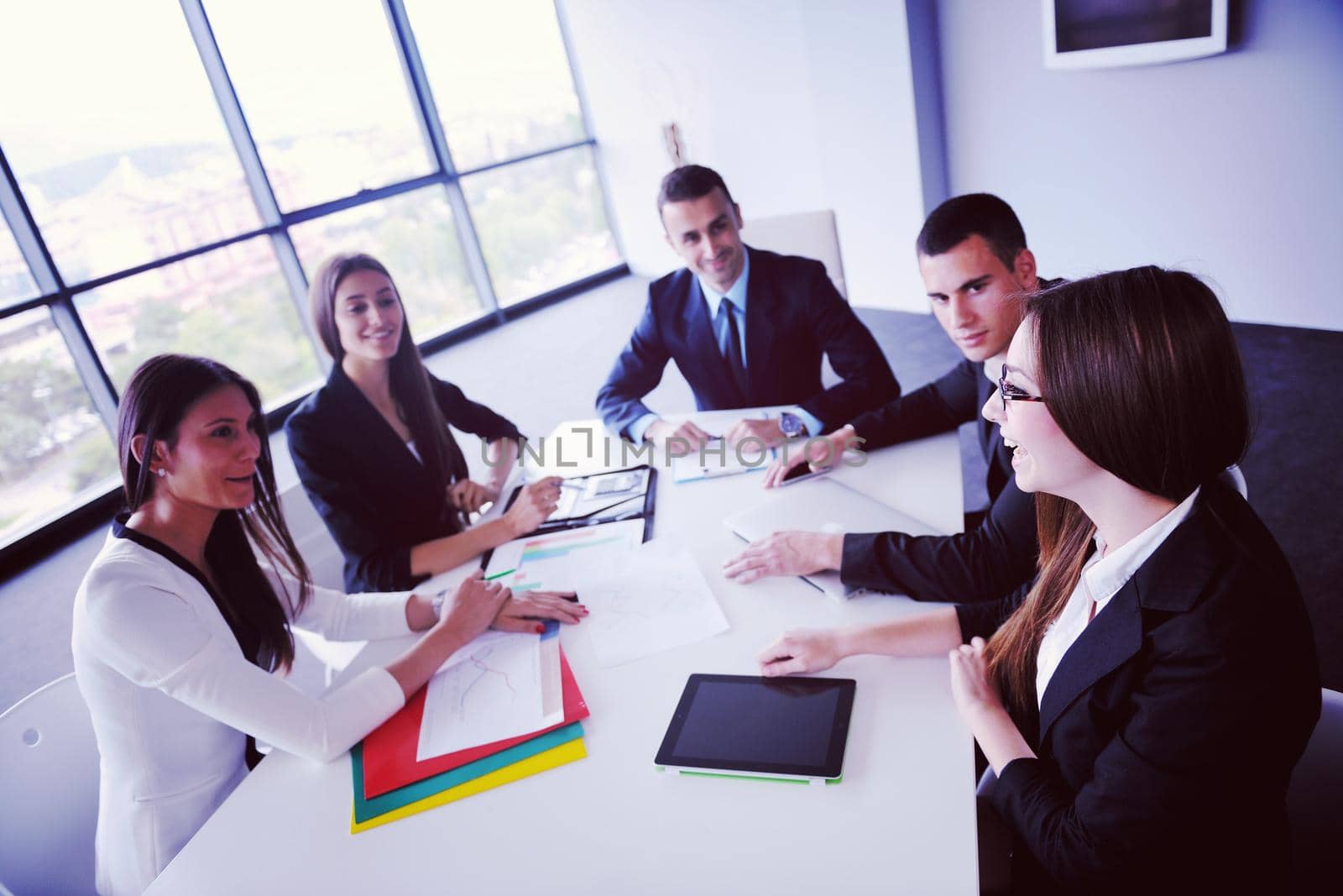 Group of happy young  business people in a meeting at office