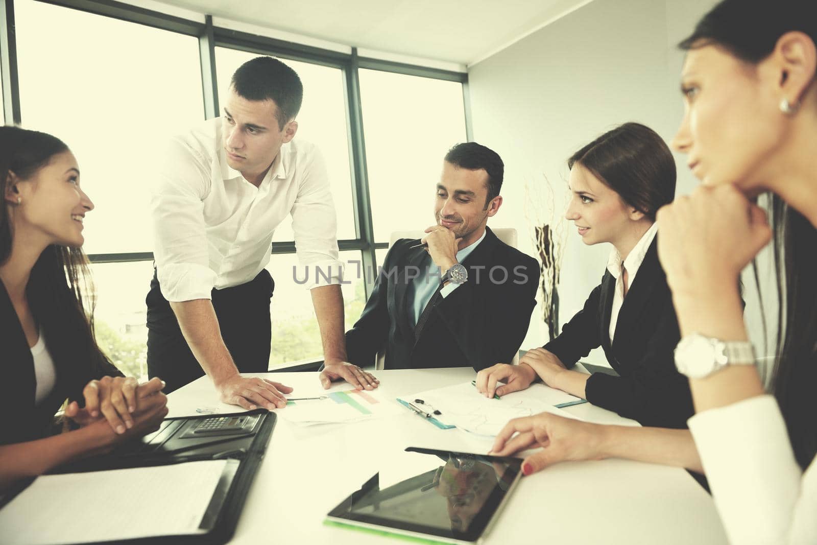 Group of happy young  business people in a meeting at office