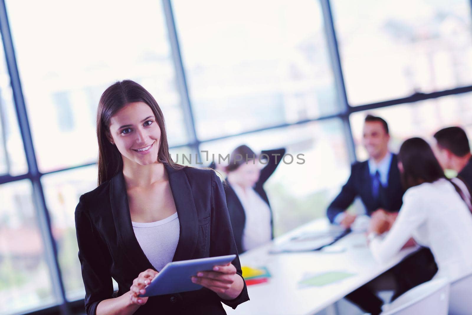 Group of happy young  business people in a meeting at office