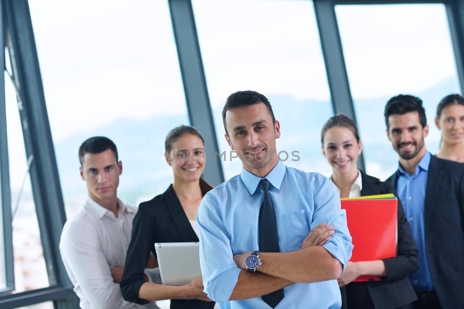 Group of happy young  business people in a meeting at office