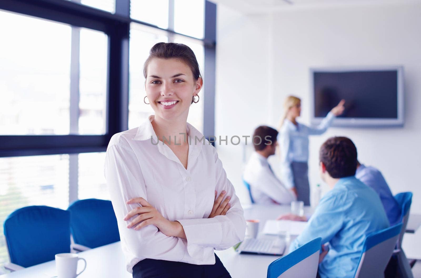 business woman  with her staff,  people group in background at modern bright office indoors