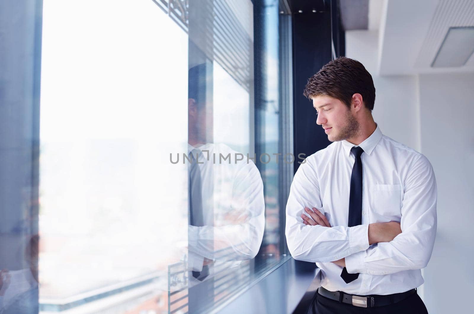 happy young business  man work in modern office on computer