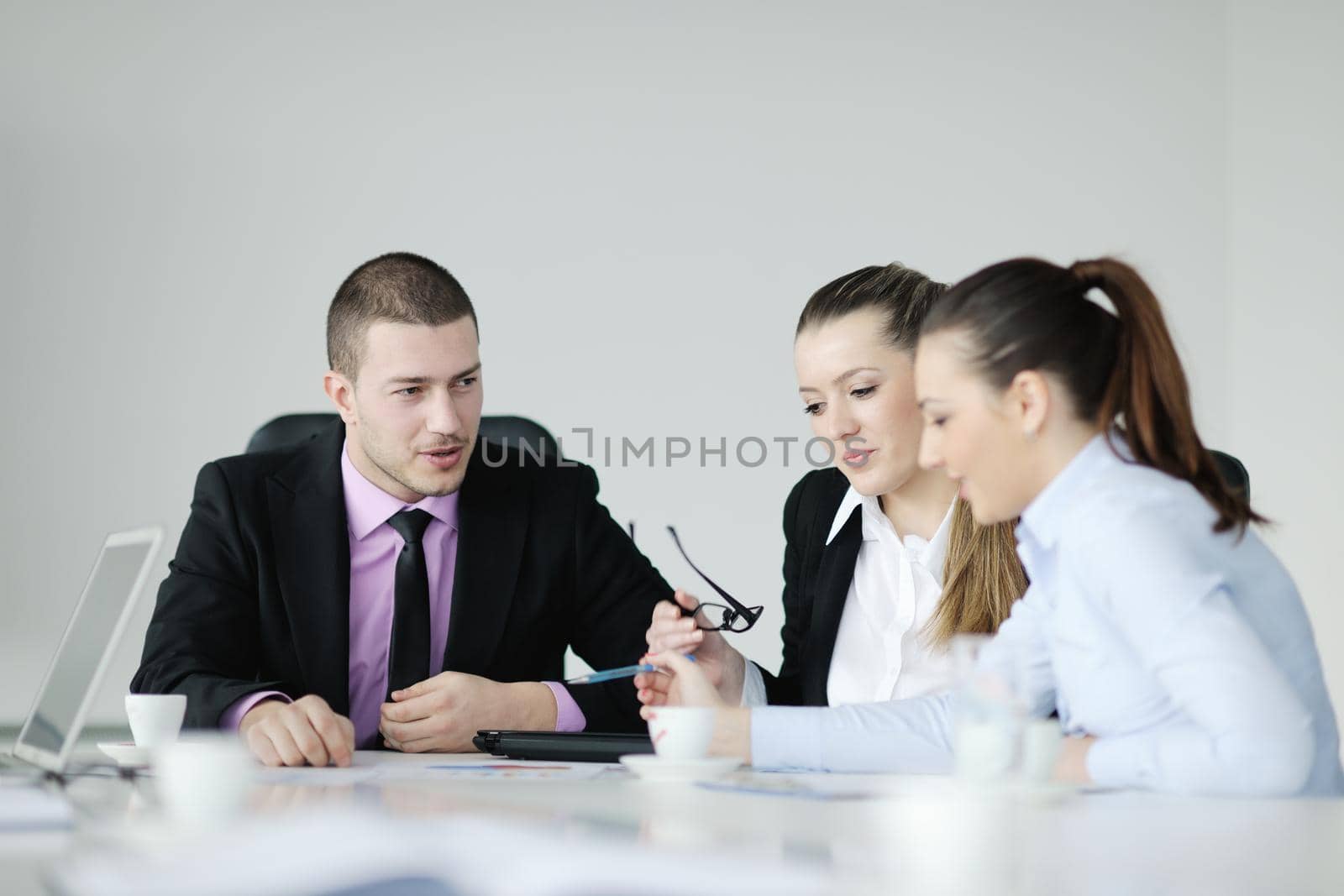 Group of young business people at meeting by dotshock