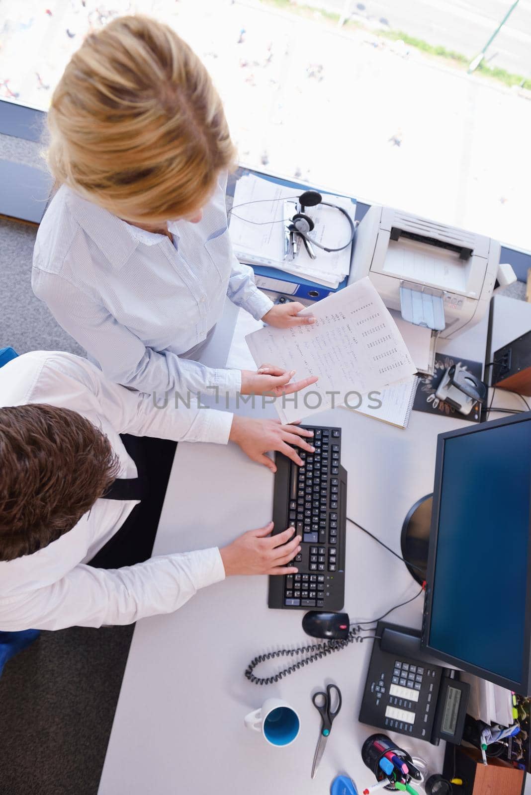 Group of happy young  business people in a meeting at office