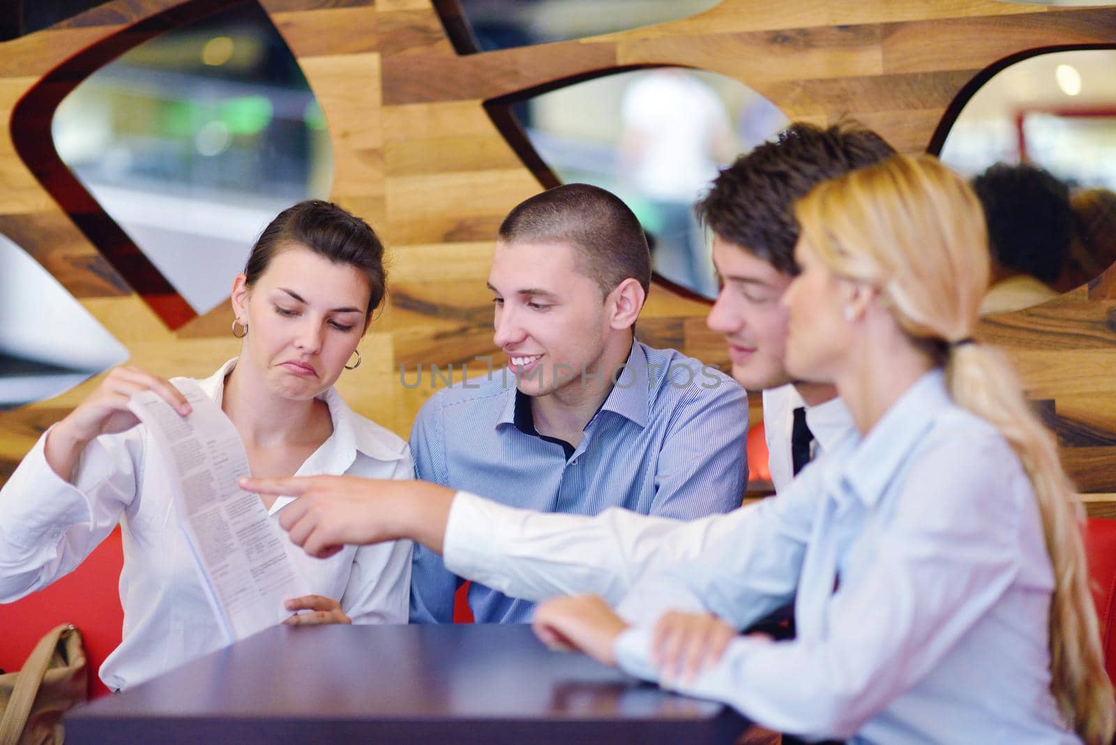 Group of happy young  business people in a meeting at office