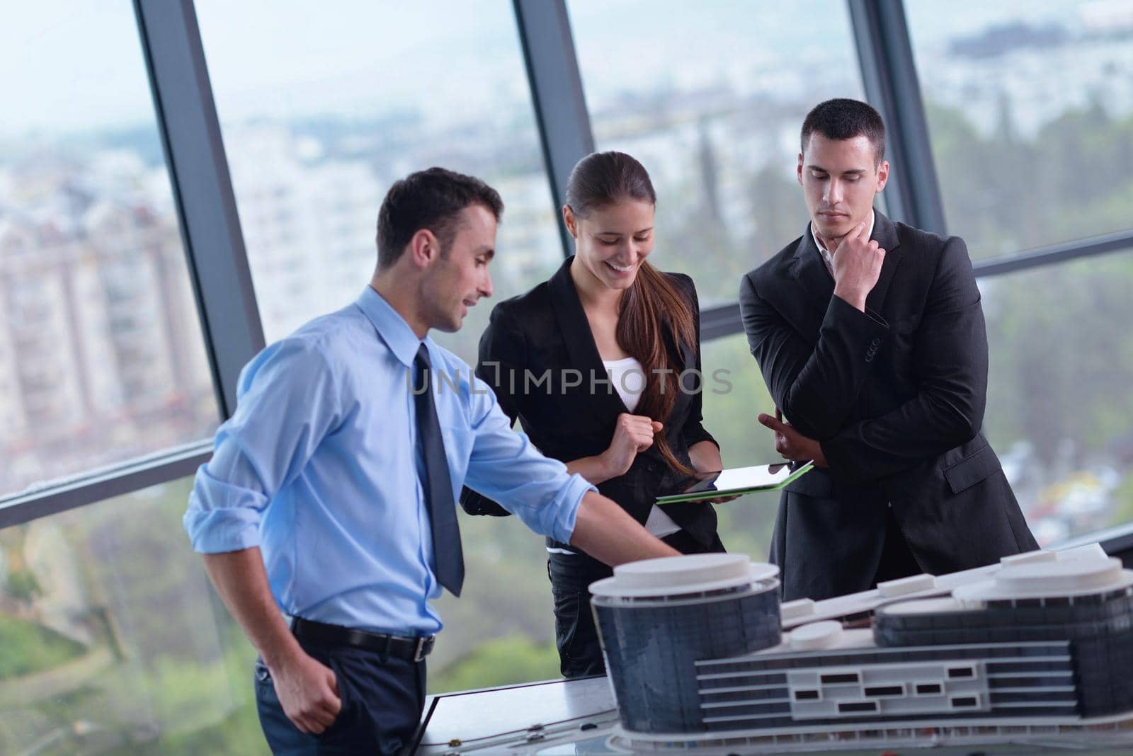 Group of happy young  business people in a meeting at office