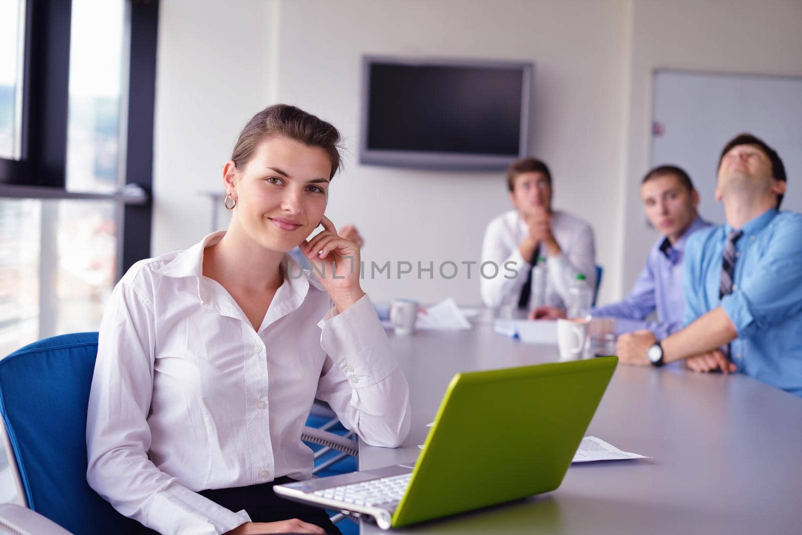 business woman  with her staff,  people group in background at modern bright office indoors