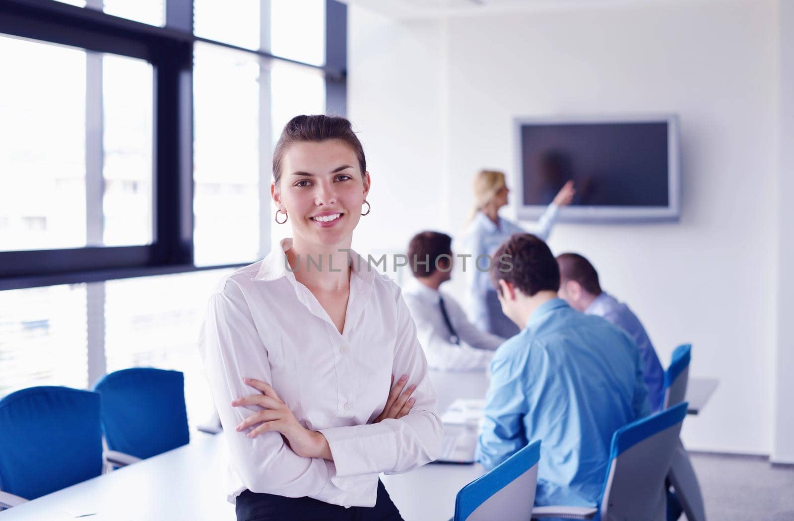 Group of happy young  business people in a meeting at office