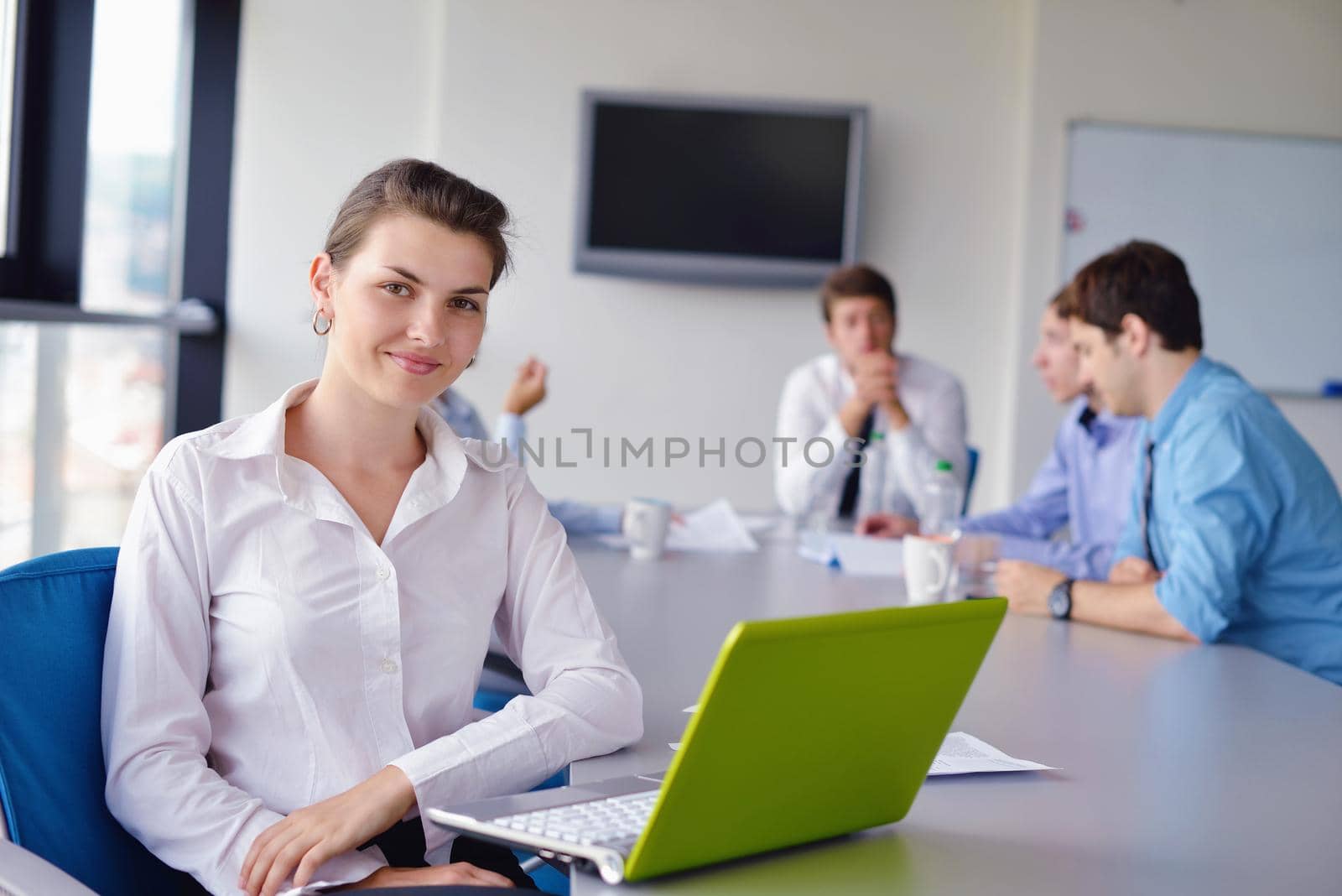 business woman  with her staff,  people group in background at modern bright office indoors