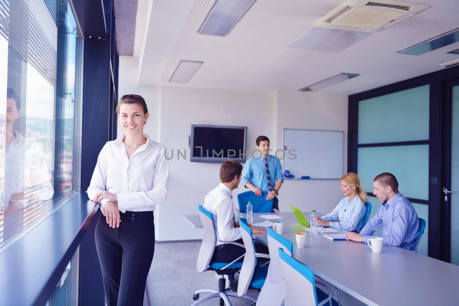 Group of happy young  business people in a meeting at office