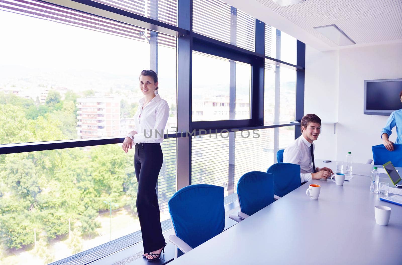 business woman  with her staff,  people group in background at modern bright office indoors