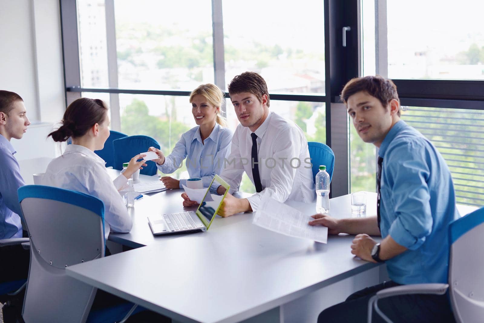 Group of happy young  business people in a meeting at office