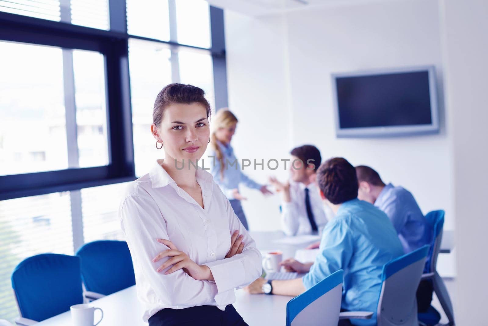 Group of happy young  business people in a meeting at office