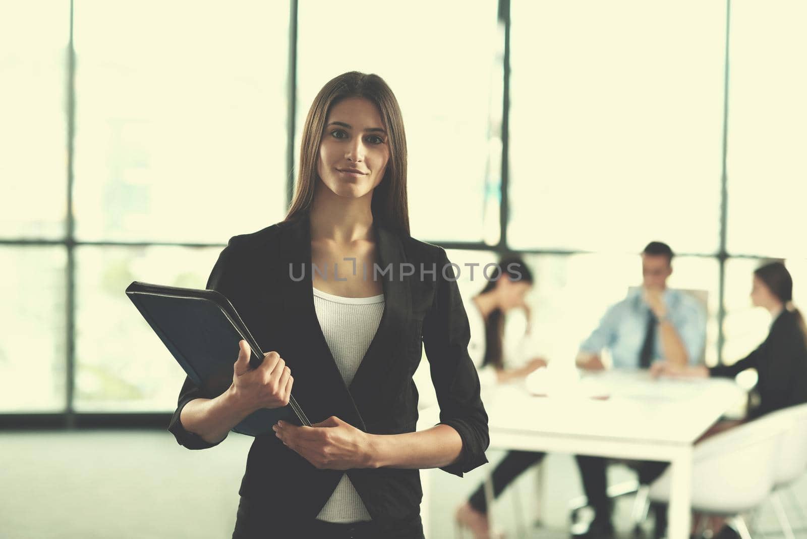 Group of happy young  business people in a meeting at office