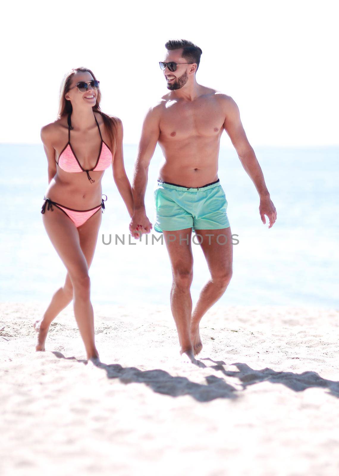 Picture of happy couple on the beach. by asdf