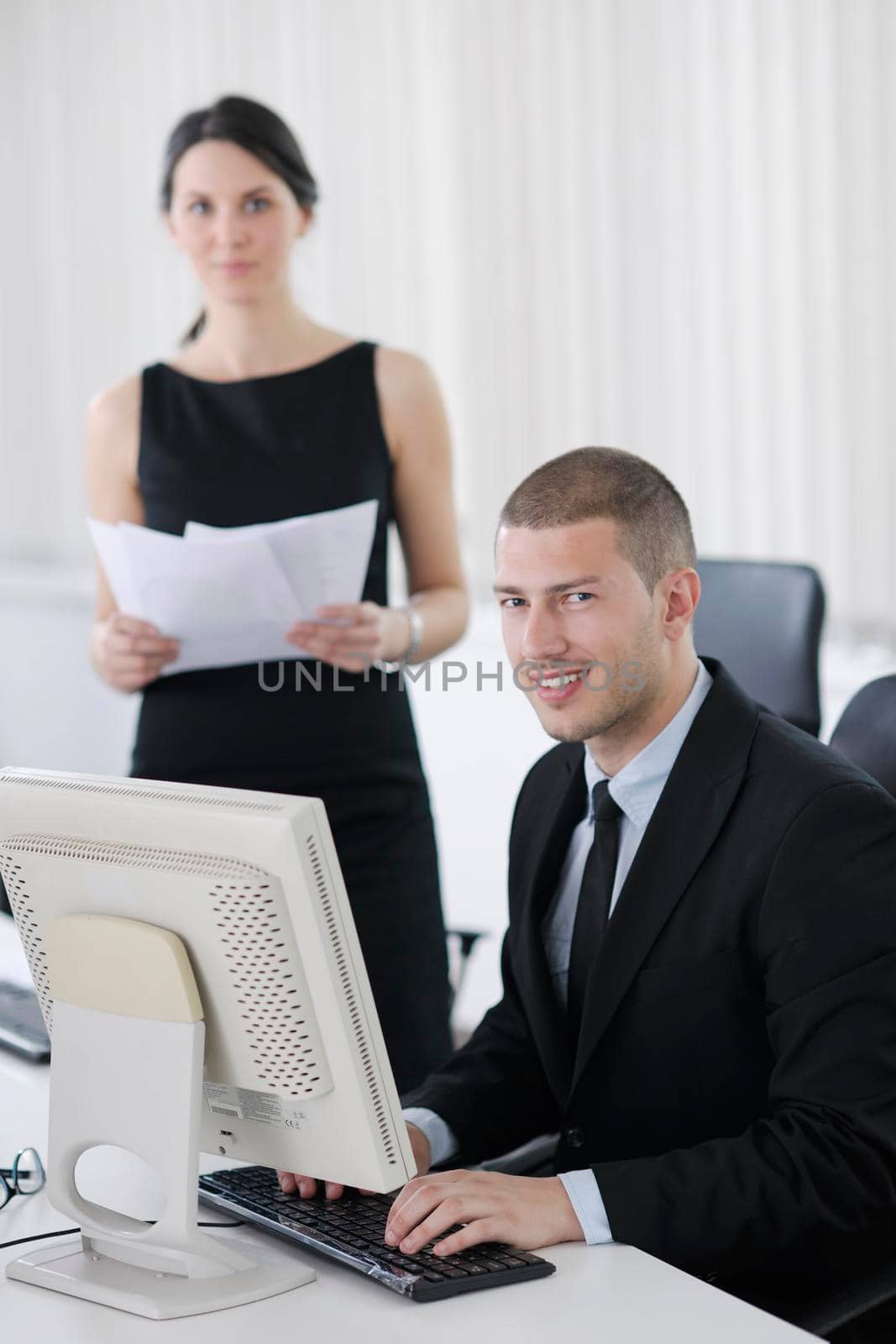 business people group working in customer and help desk office by dotshock