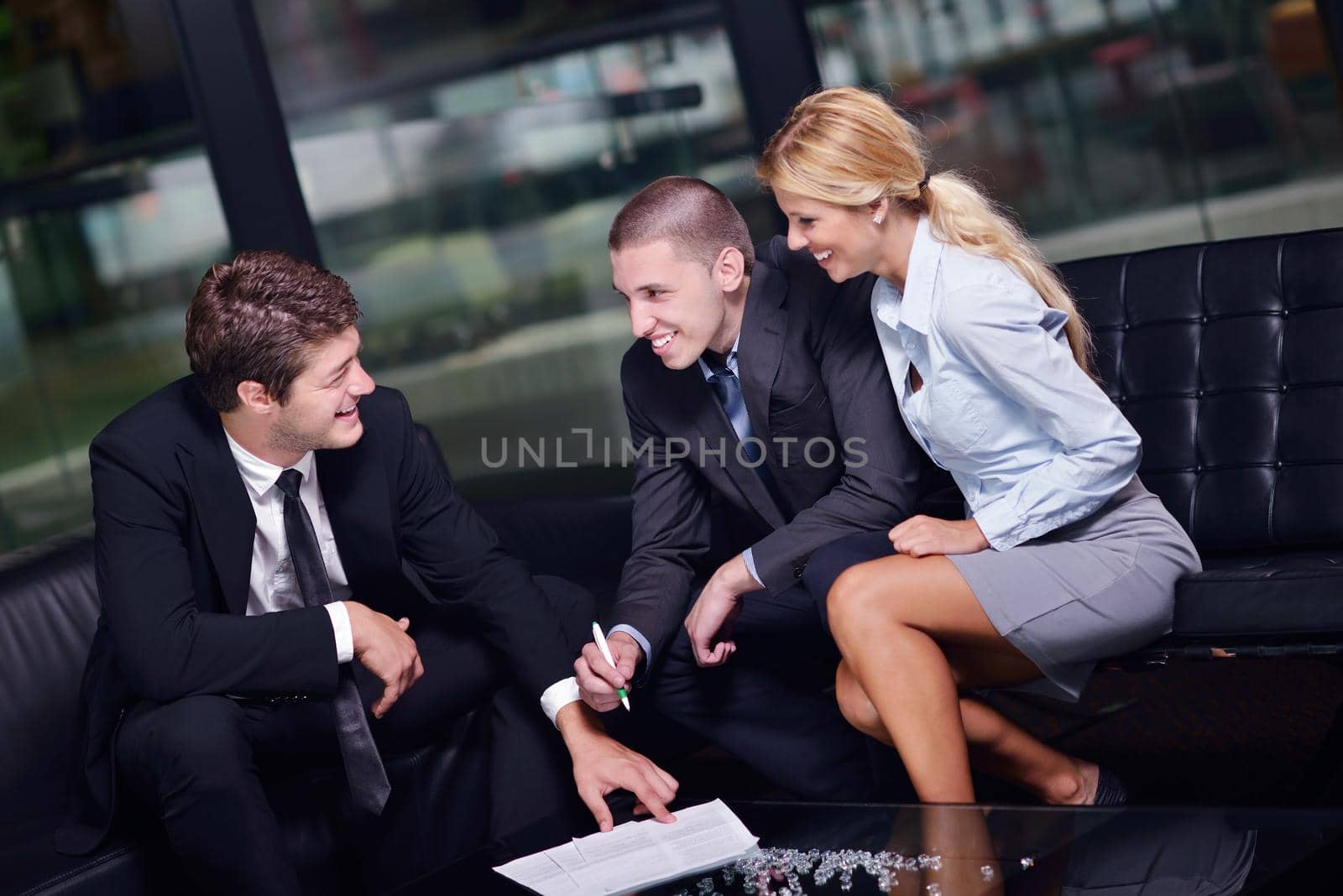 Group of happy young  business people in a meeting at office