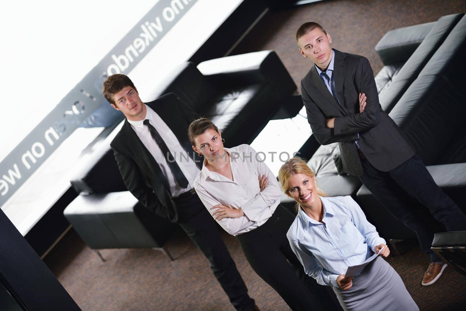 Group of happy young  business people in a meeting at office