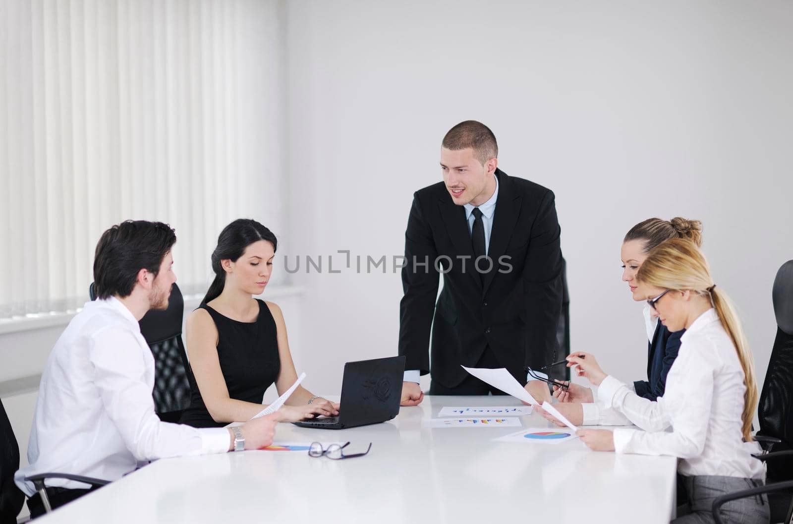 Group of happy young  business people in a meeting at office