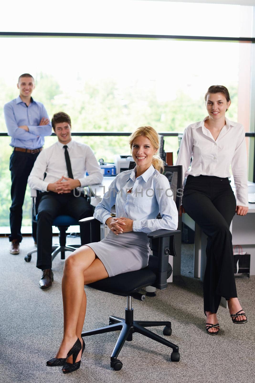 business woman  with her staff,  people group in background at modern bright office indoors