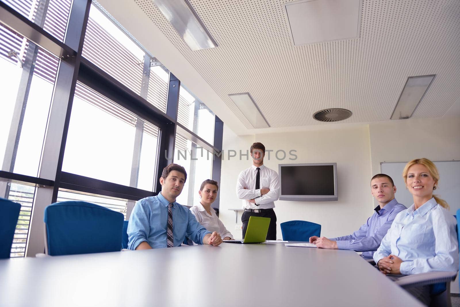 business people in a meeting at office by dotshock