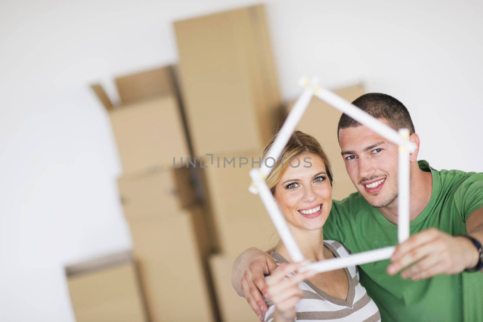 Young couple moving in new home by dotshock