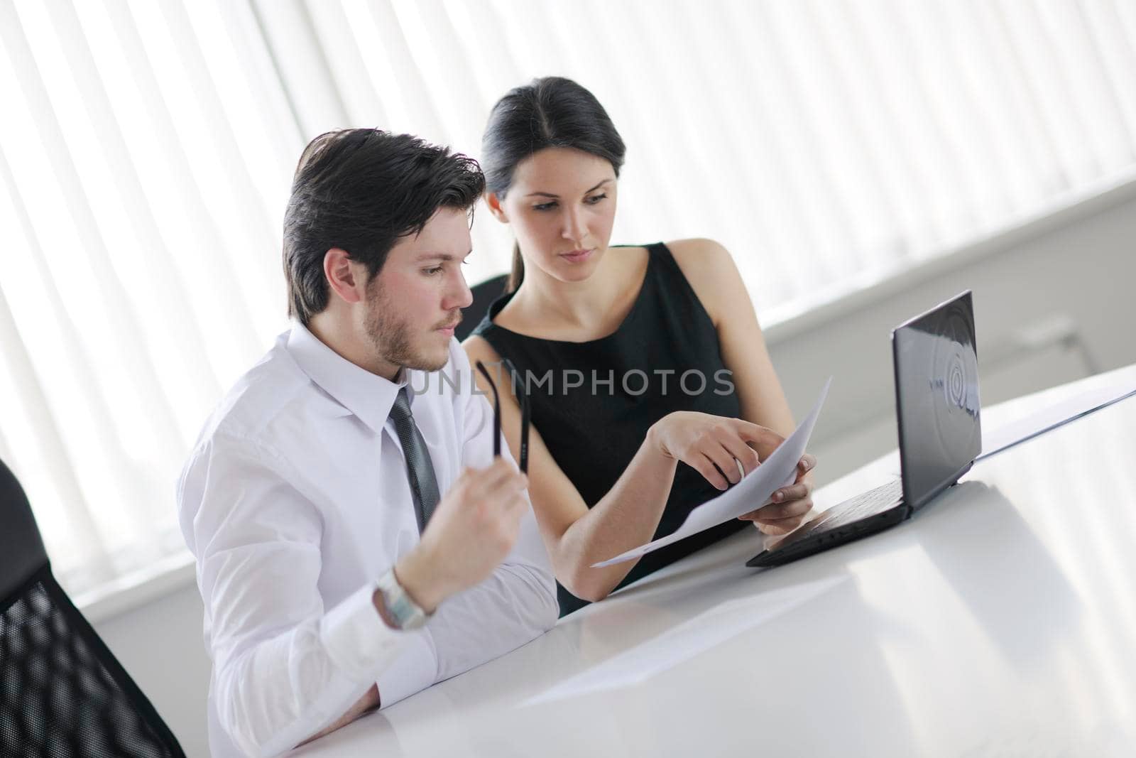 Group of happy young  business people in a meeting at office