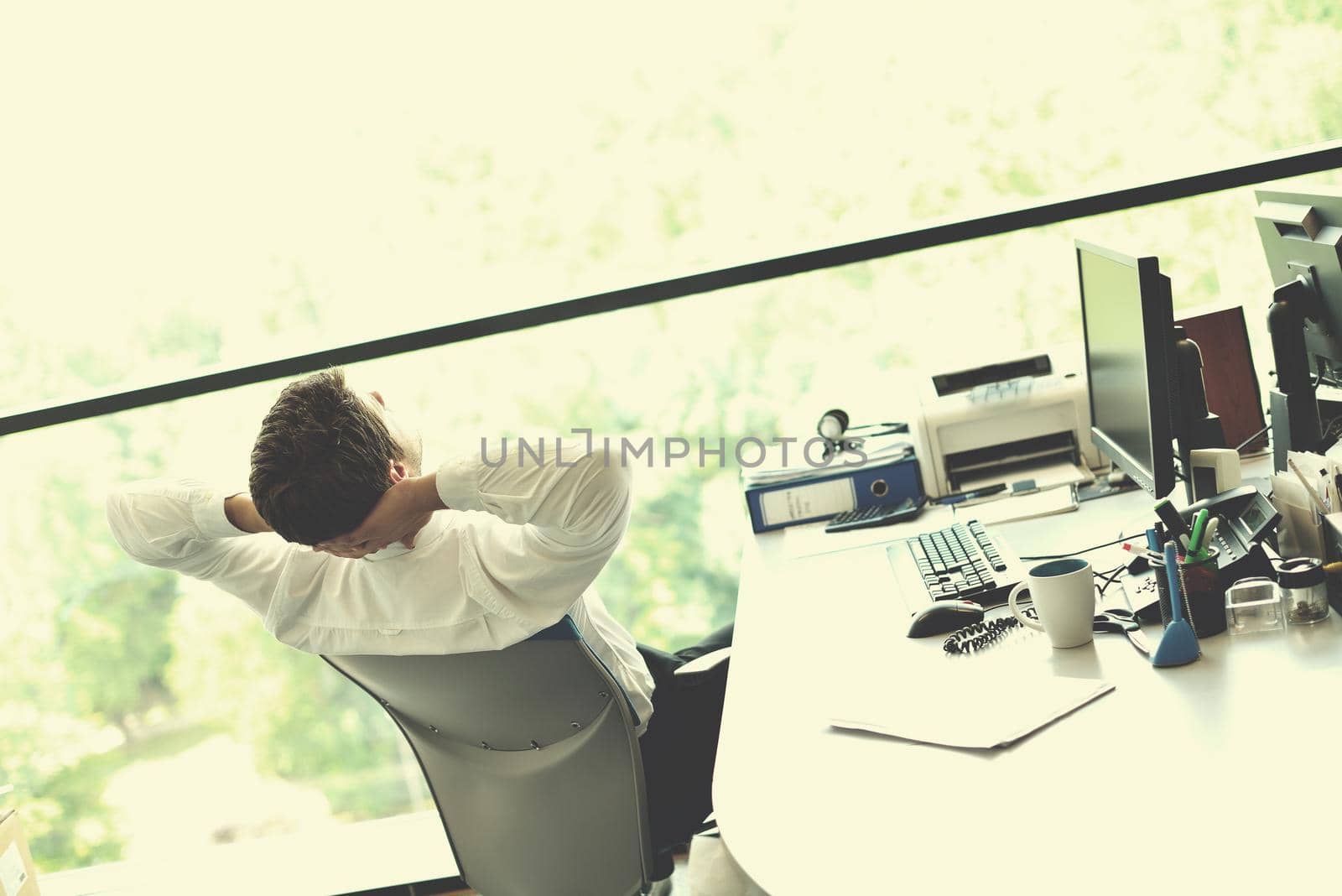 happy young business  man work in modern office on computer