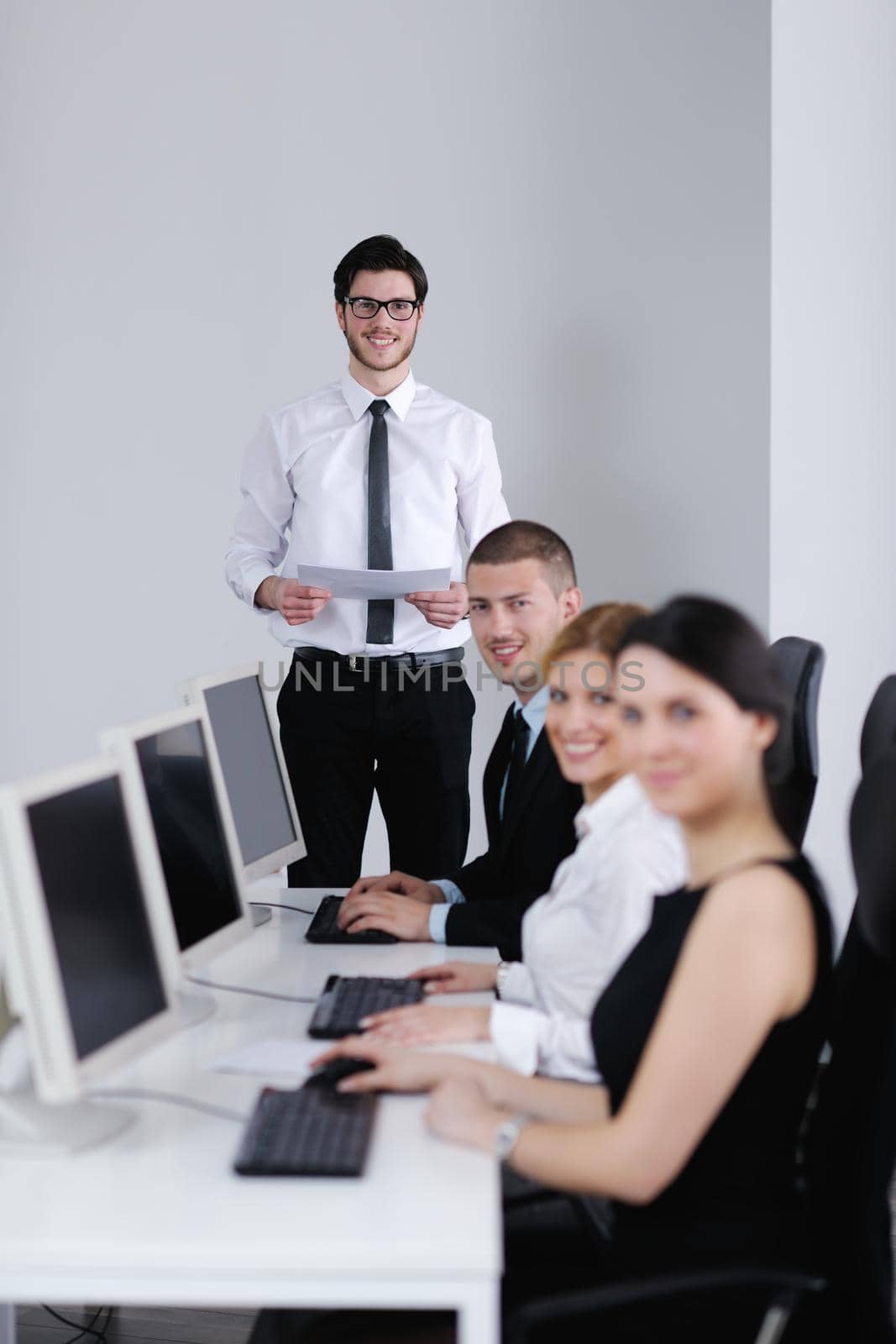 business people group working in customer and helpdesk office by dotshock
