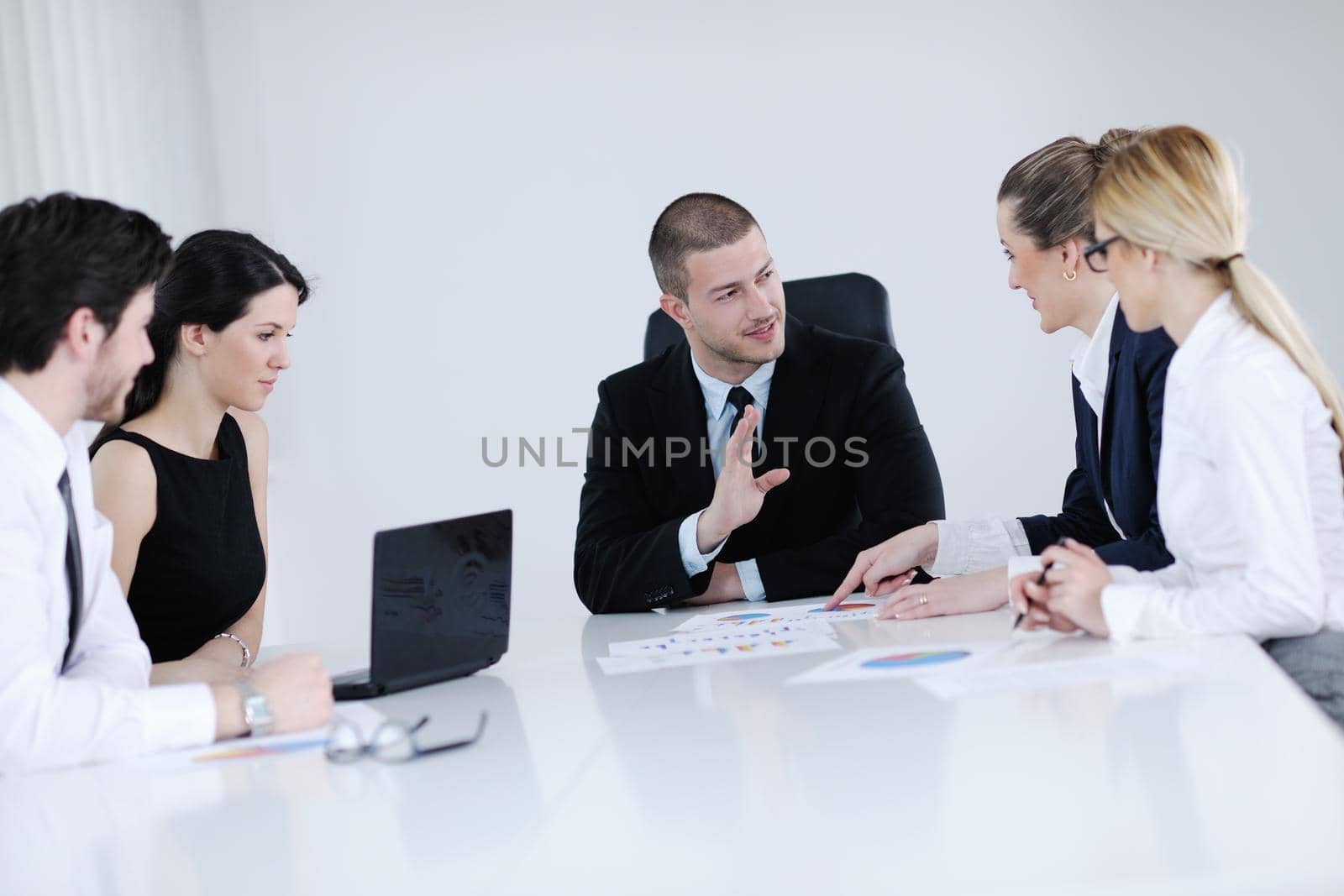 Group of happy young  business people in a meeting at office