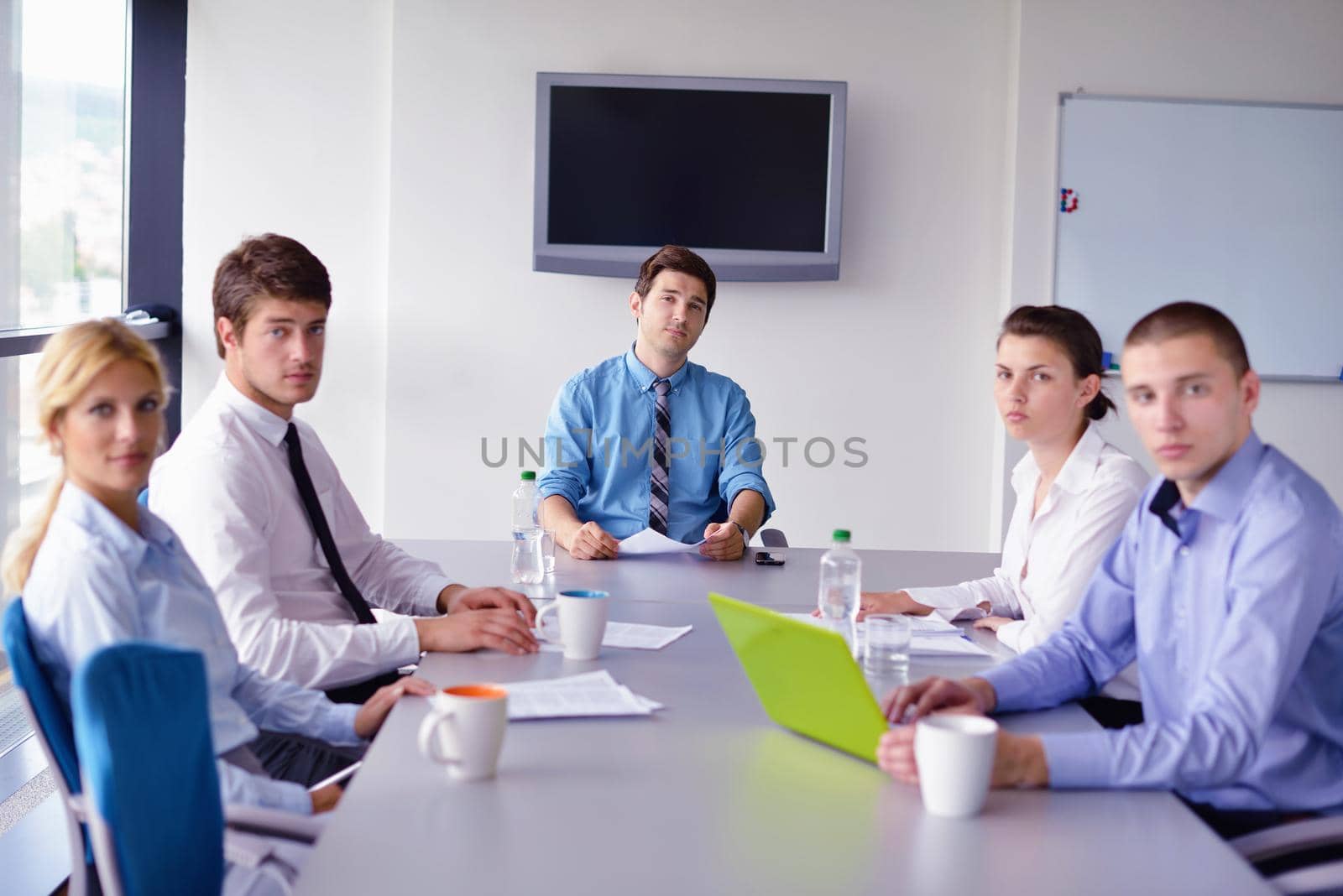 business people in a meeting at office by dotshock