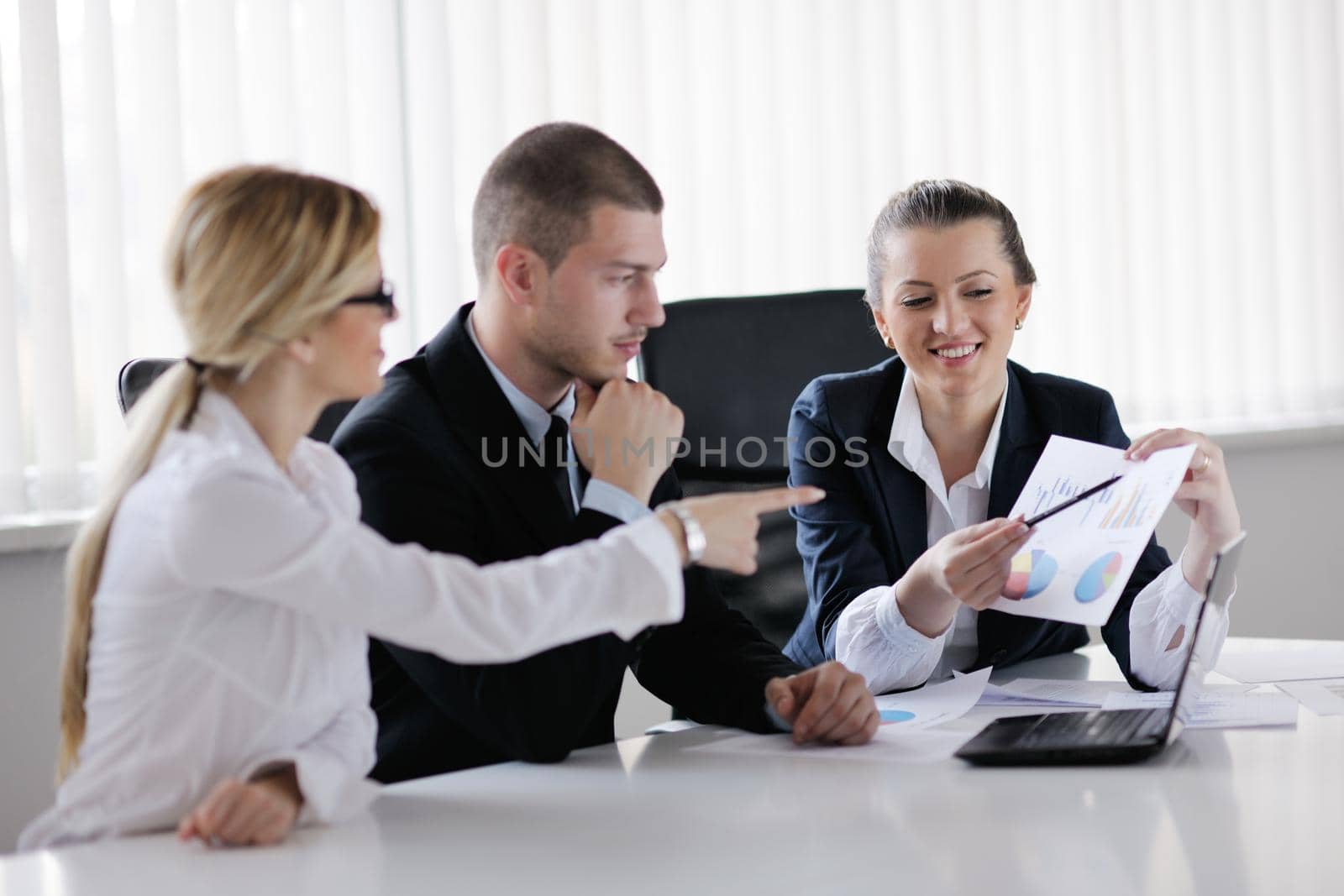 Group of happy young  business people in a meeting at office