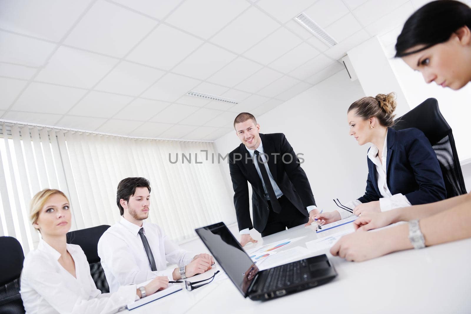 Group of happy young  business people in a meeting at office