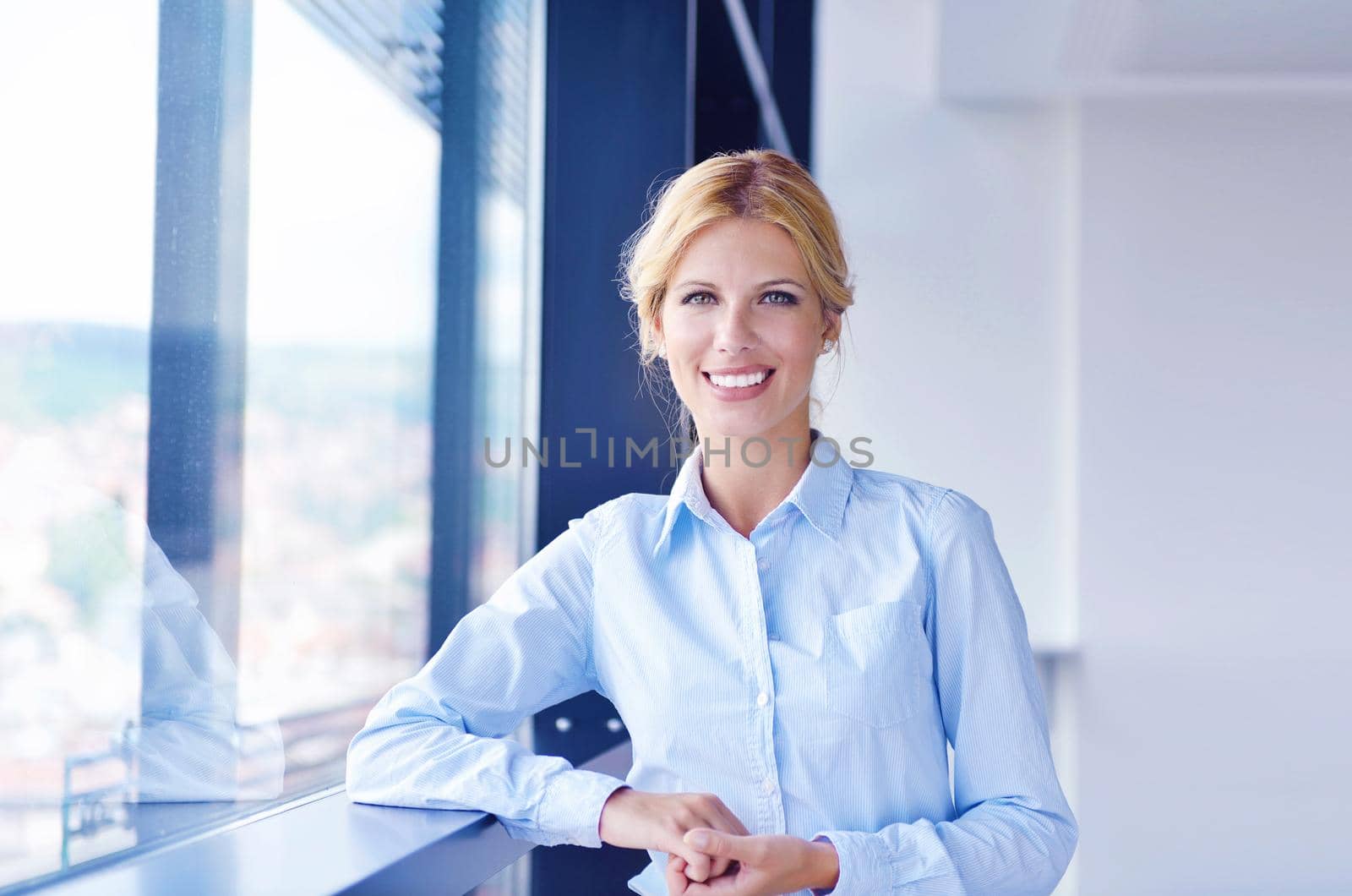 business woman  with her staff,  people group in background at modern bright office indoors