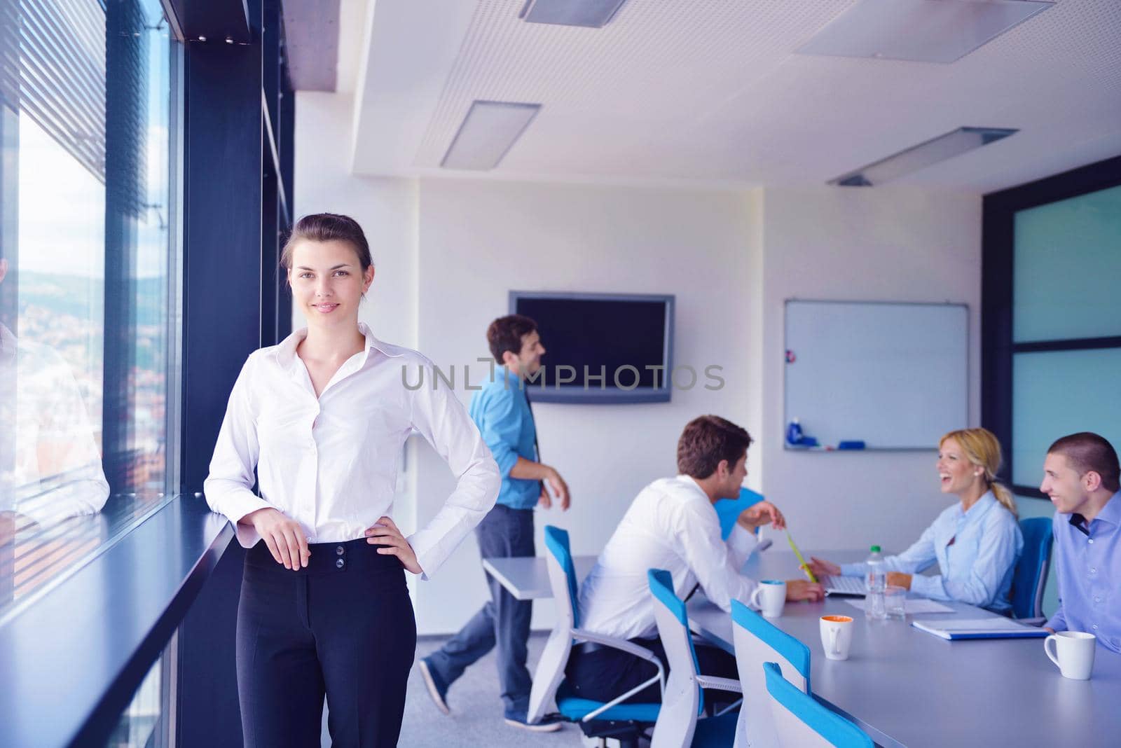 Group of happy young  business people in a meeting at office