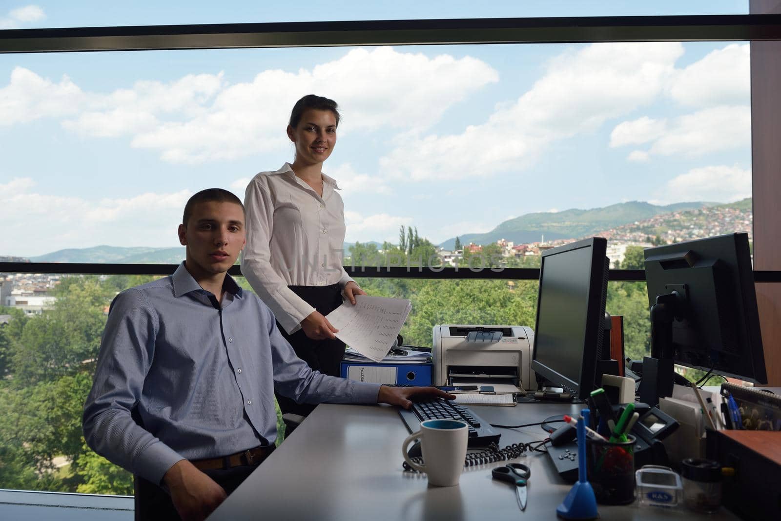 Group of happy young  business people in a meeting at office