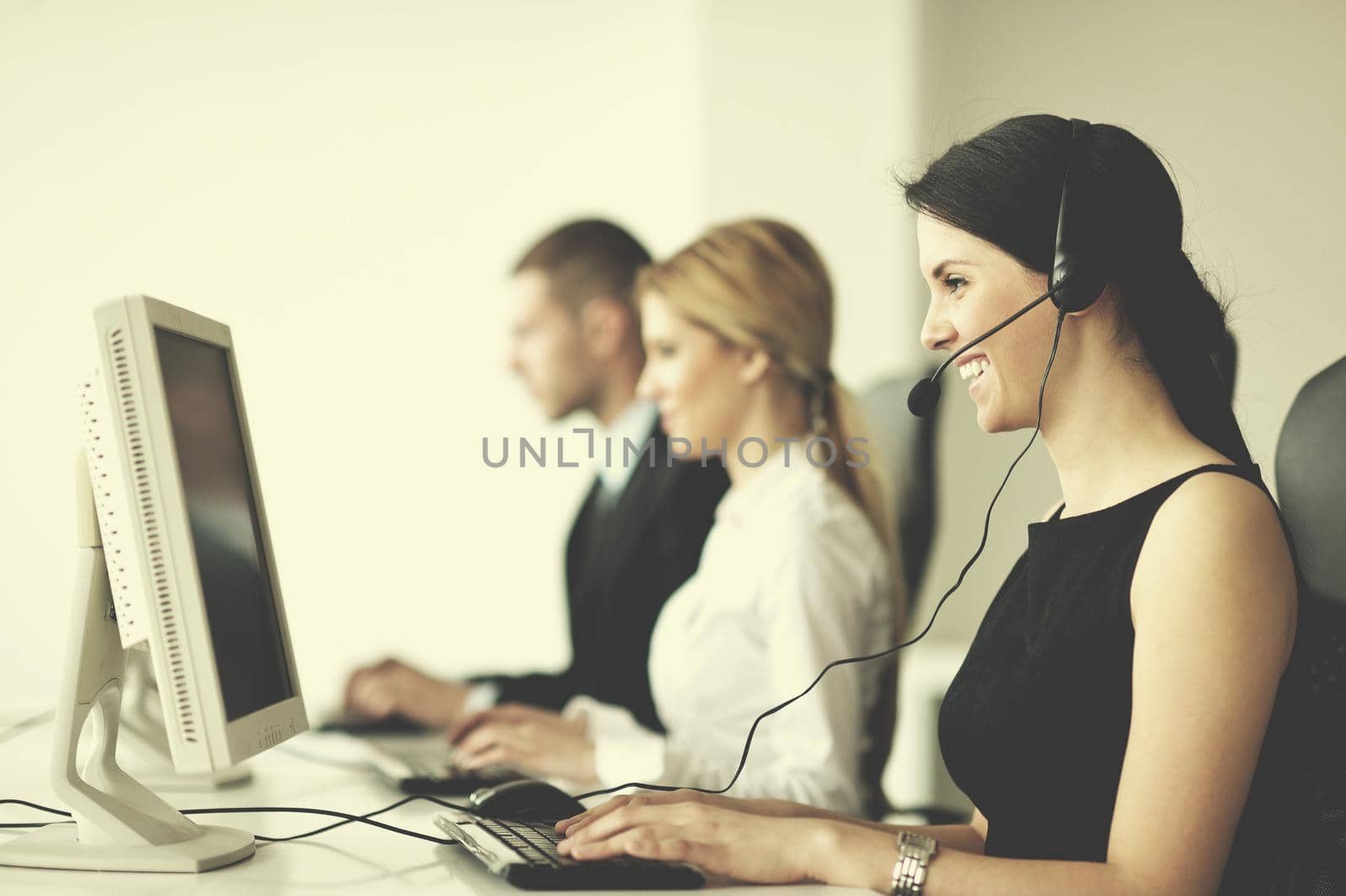 business people group with  headphones giving support in  help desk office to customers, manager giving training and education instructions