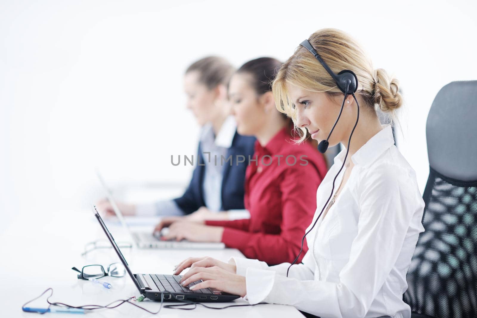business woman group with headphones by dotshock