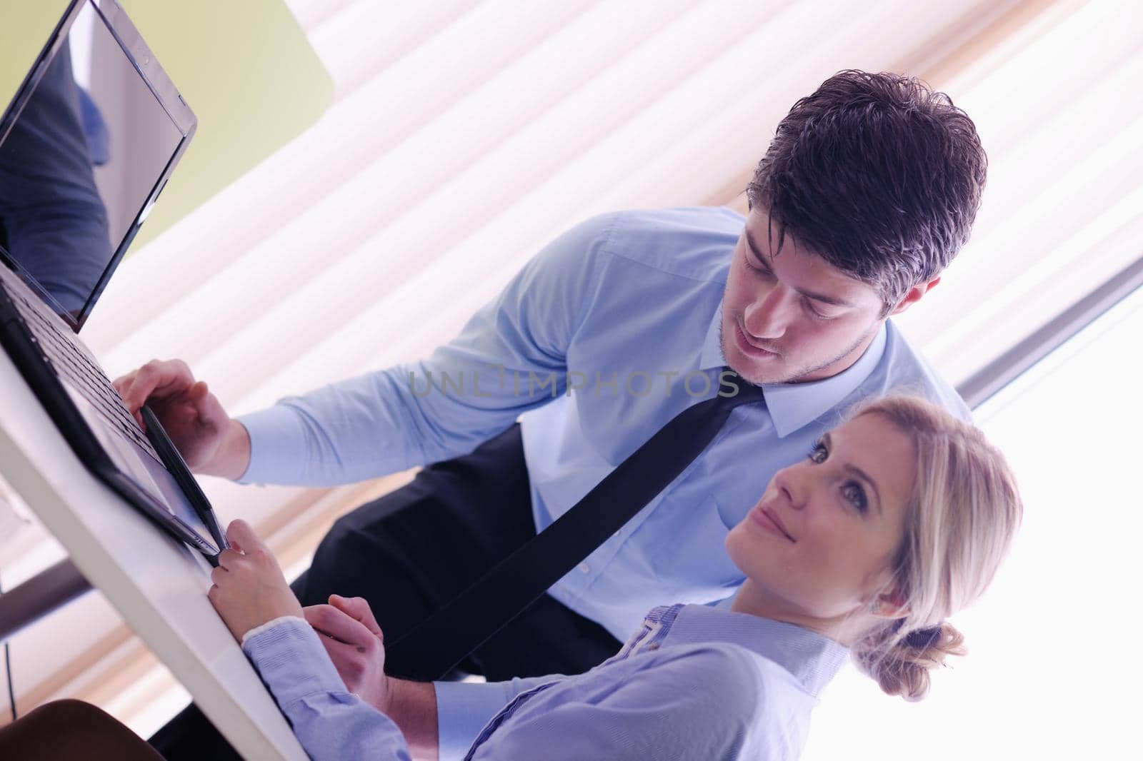 Group of happy young  business people in a meeting at office