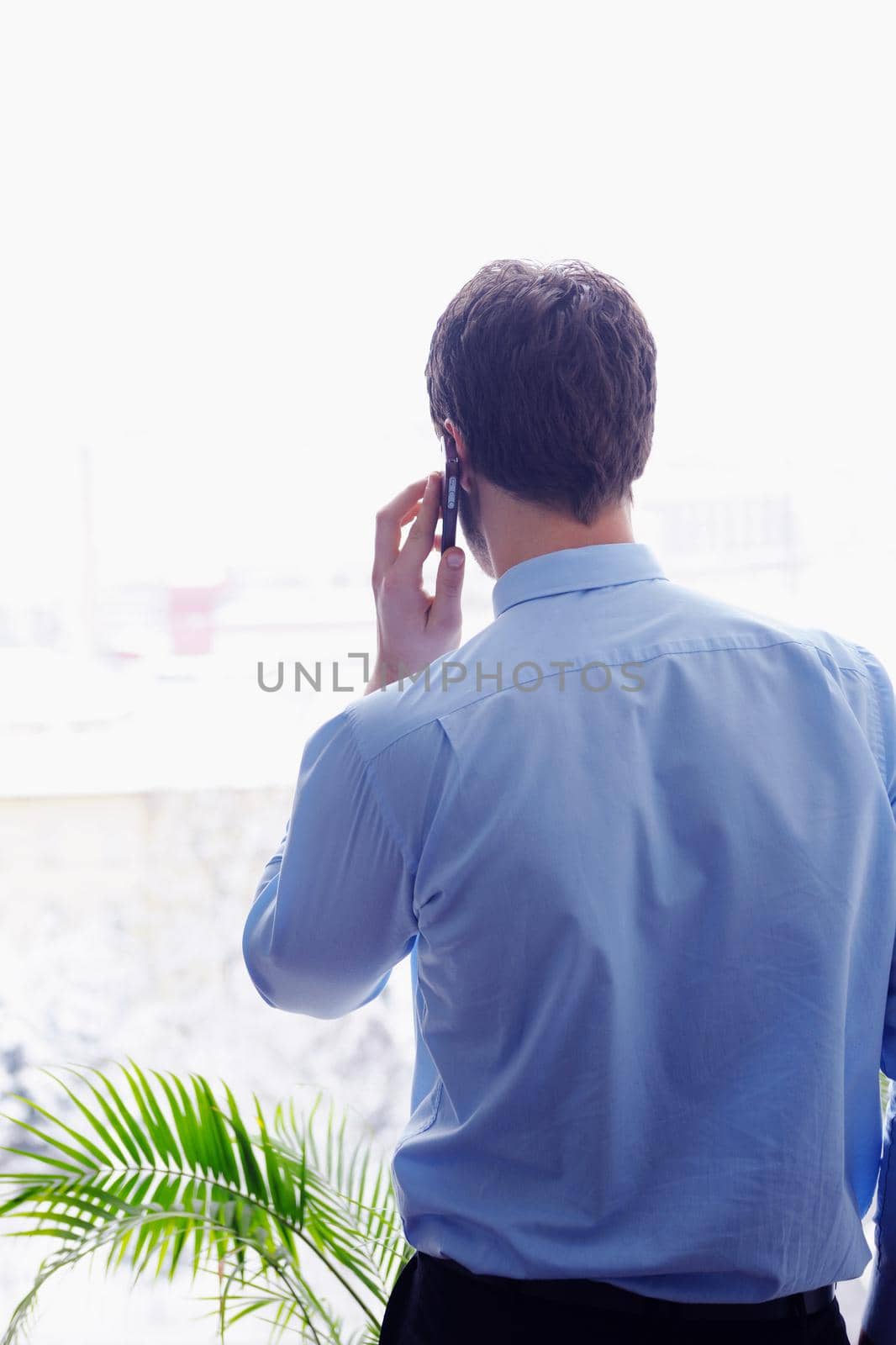 business man talking by cellphone by dotshock