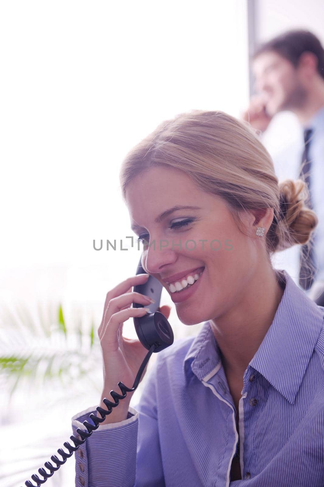 Portrait of a beautiful business woman talk by phone