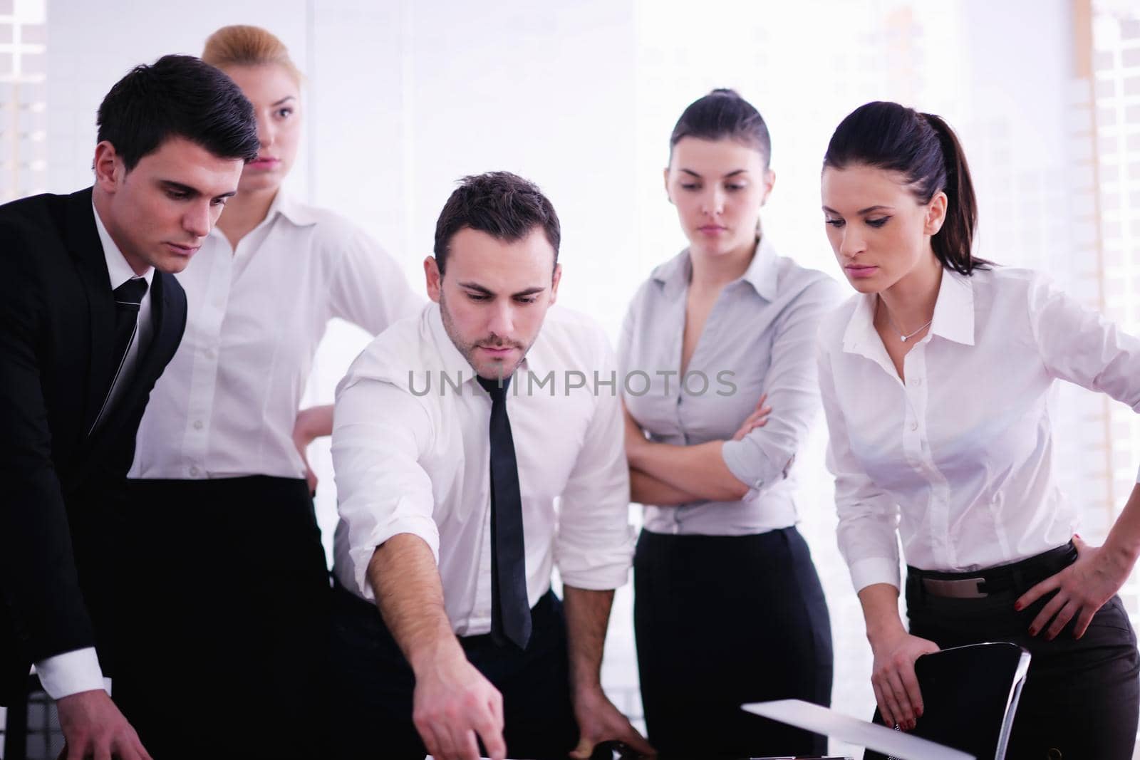 Group of happy young  business people in a meeting at office