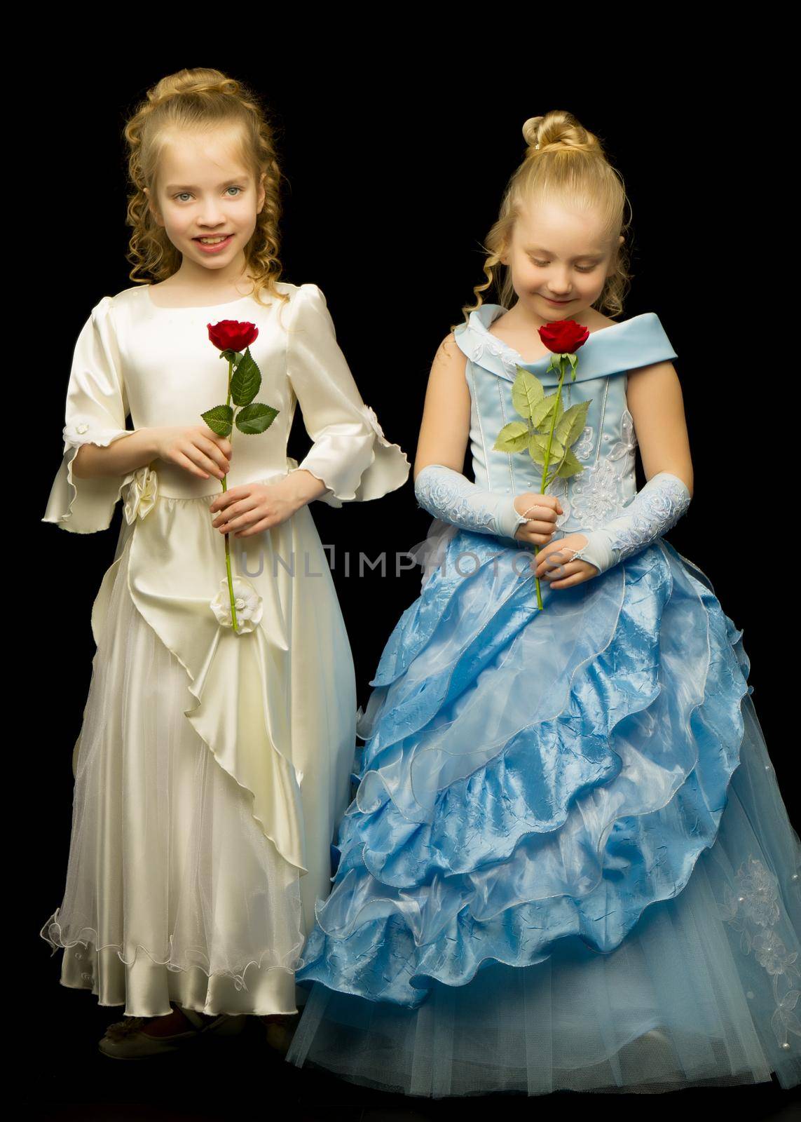 Two princess girls with flowers on a black background. by kolesnikov_studio